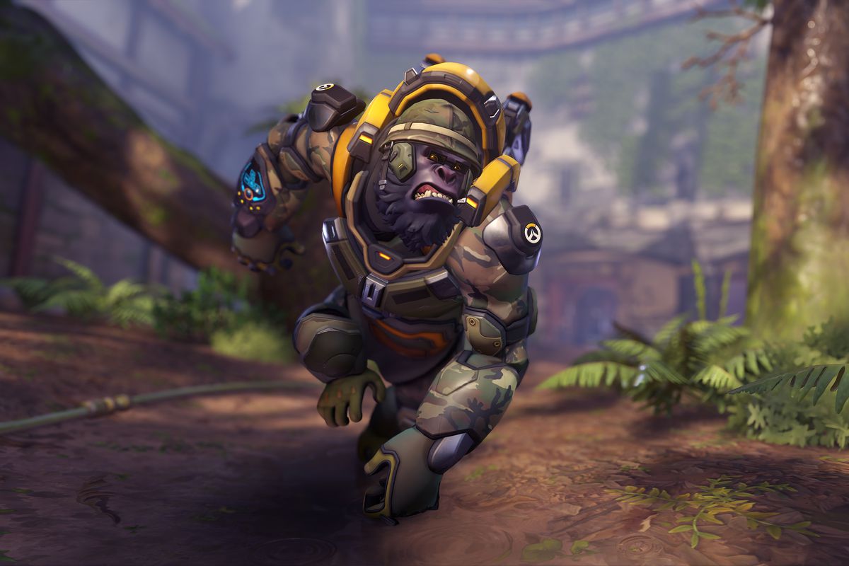Winston the gorilla runs through a jungle setting wearing a military skin in Overwatch 2