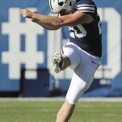 Brigham Young Cougars place kicker Skyler Southam (20) kicks off against USC Trojans in Provo on Saturday, Sept. 14, 2019. BYU won 30-27 in overtime.