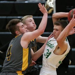South Summit's Kael Atkinson comes under pressure from Emery's Brax Jensen and Kyson Stilson during a 3A boys basketball first round game at Wasatch High School in Heber City on Saturday, Feb. 17, 2018.