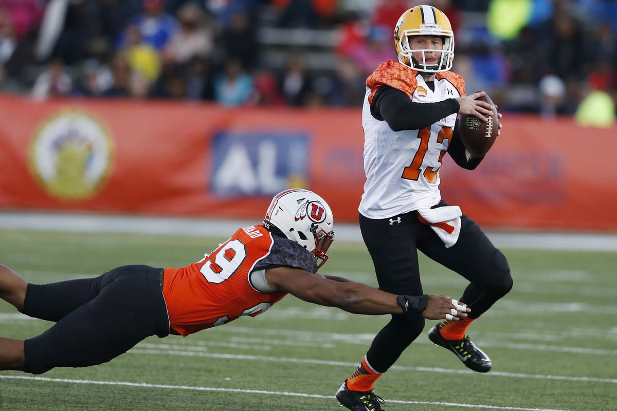 Southeastern quarterback Bryan Bennett Louisiana (13) sets back to throw as of Utah defensive end Nate Orchard (99) attempts the tackle in the second half during NCAA college football game at the Senior Bowl, Saturday, Jan. 24, 2015, in Mobile, Ala. (AP P