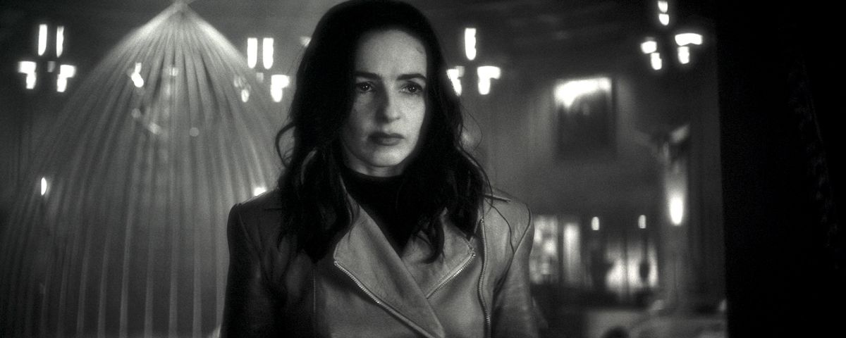 A candlelit Laura Donnelly looms into frame looking grim as Elsa Bloodstone in Werewolf By Night