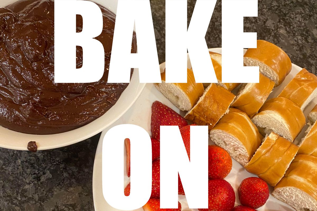 Text, “BAKE ON” in white block letters superimposed over a photo of sliced bread and strawberries on a plate next to a bowl of melted chocolate