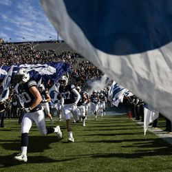 Brigham Young Cougars players enter the field before a game at LaVell Edwards Stadium in Provo on Saturday, Nov. 19, 2016.