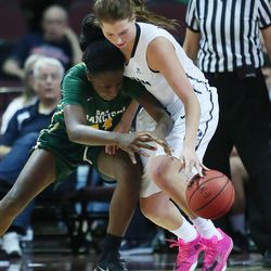 Brigham Young Cougars forward Amanda Wayment (4) and San Francisco Lady Dons forward Hashima Carothers (44) compete for the ball during the WCC tournament championship in Las Vegas Tuesday, March 8, 2016. San Francisco won 70-68. 