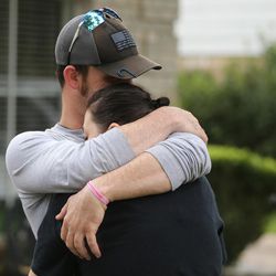 Nick Drake hugs his girlfriend, Wendy Whatley, during cleanup efforts in Klein, Texas, on Wednesday, Aug. 30, 2017, following Tropical Storm Harvey.