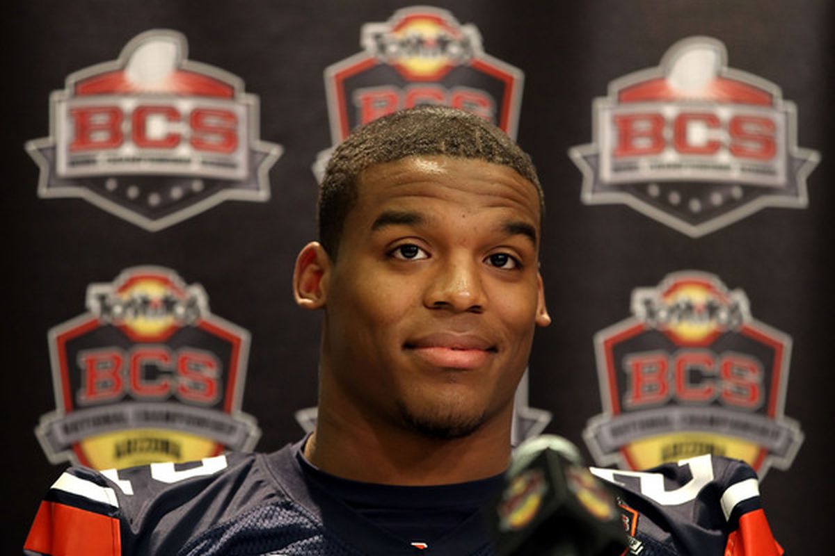  Quarterback Cam Newton  of the Auburn Tigers talks with the media during Media Day for the Tostitos BCS National Championship Game at the JW Marriott Camelback Inn on January 7 2011 in Scottsdale Arizona.  (Photo by Christian Petersen/Getty Images)