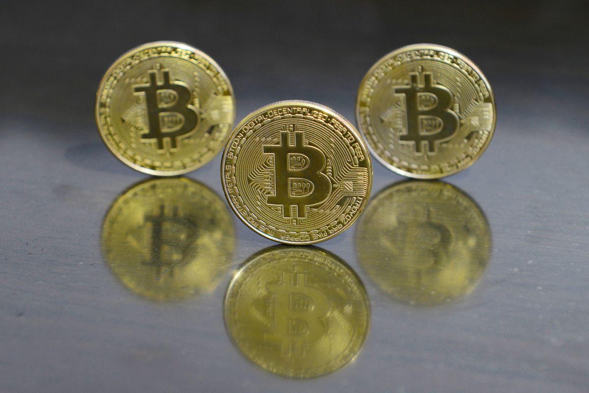 In this photo illustration, Bitcoin coins seen on display...