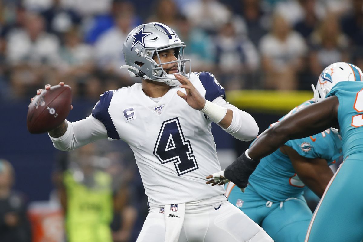 Dallas Cowboys quarterback Dak Prescott throws a pass in the first quarter against the Miami Dolphins at AT&amp;T Stadium.