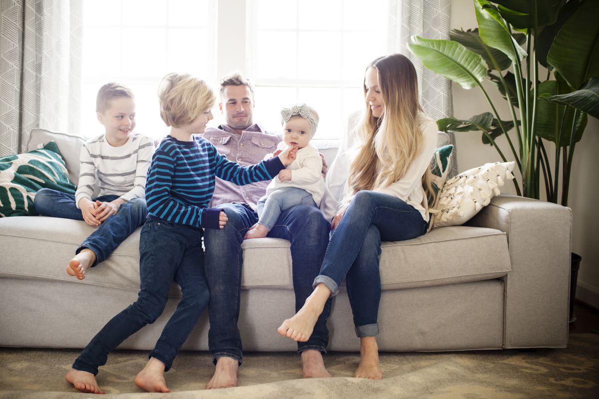 Jessica and Neil Smart with their children Ryder, 9, Kylan, 7, and Iyla, 9 months (left to right) in their home in Frederick, MD. Not pictured: Nyah, 12.