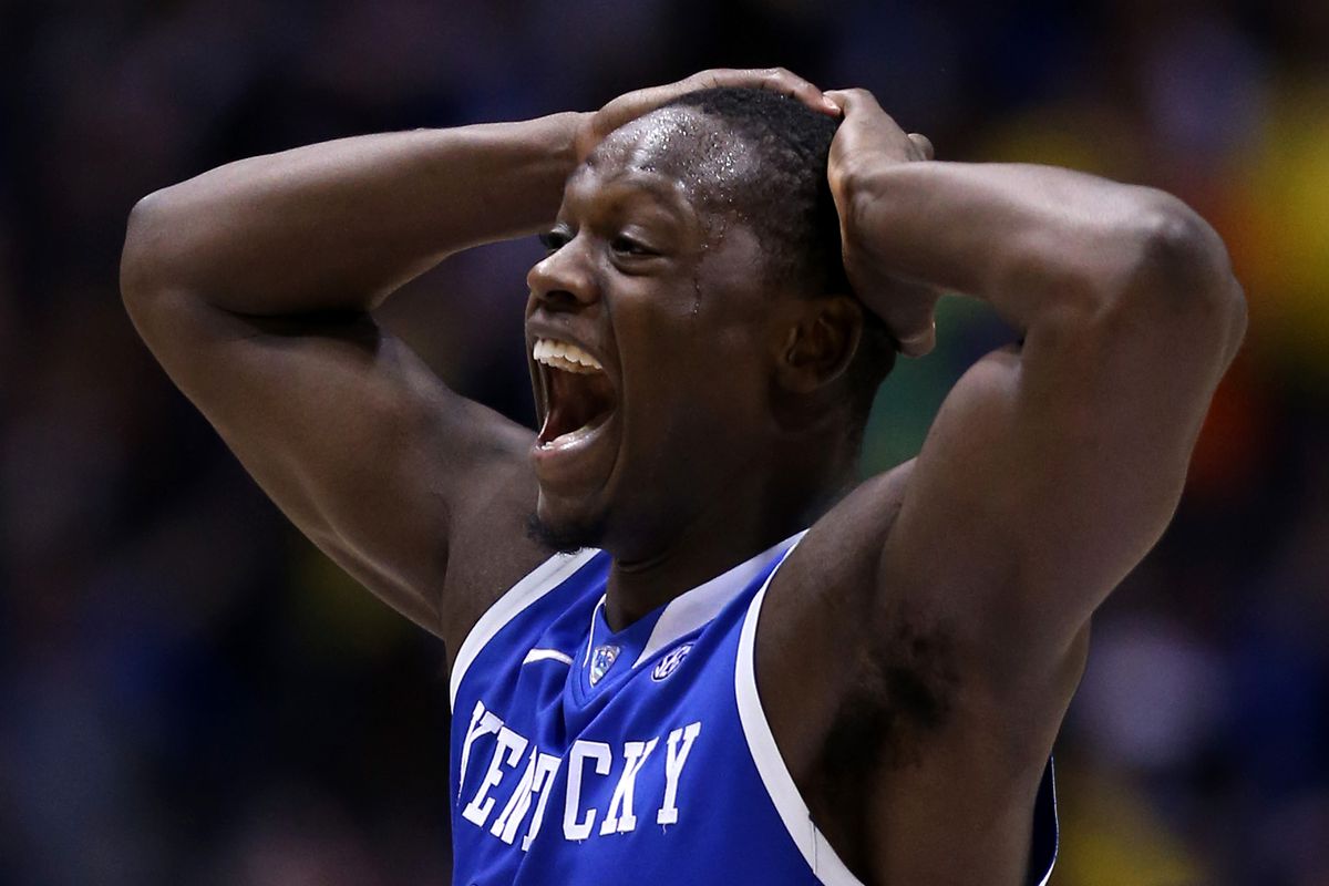 INDIANAPOLIS, IN - MARCH 30: Julius Randle #30 of the Kentucky Wildcats celebrates after defeating the Michigan Wolverines 75 to 72 in the midwest regional final of the 2014 NCAA Men's Basketball Tournament at Lucas Oil Stadium on March 30, 2014 in I
