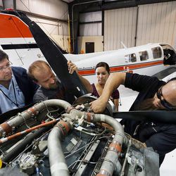 Students Kris Hao, right, Rozie Nelson and Eric Watters learn from instructor Todd Baird at Salt Lake Community College Aviation Training in Salt Lake City on Wednesday, Sept. 23, 2015.