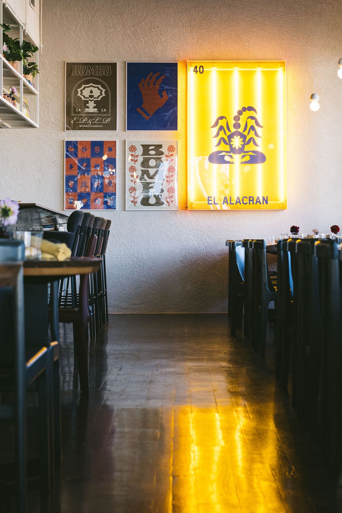 Colored prints on restaurant wall.