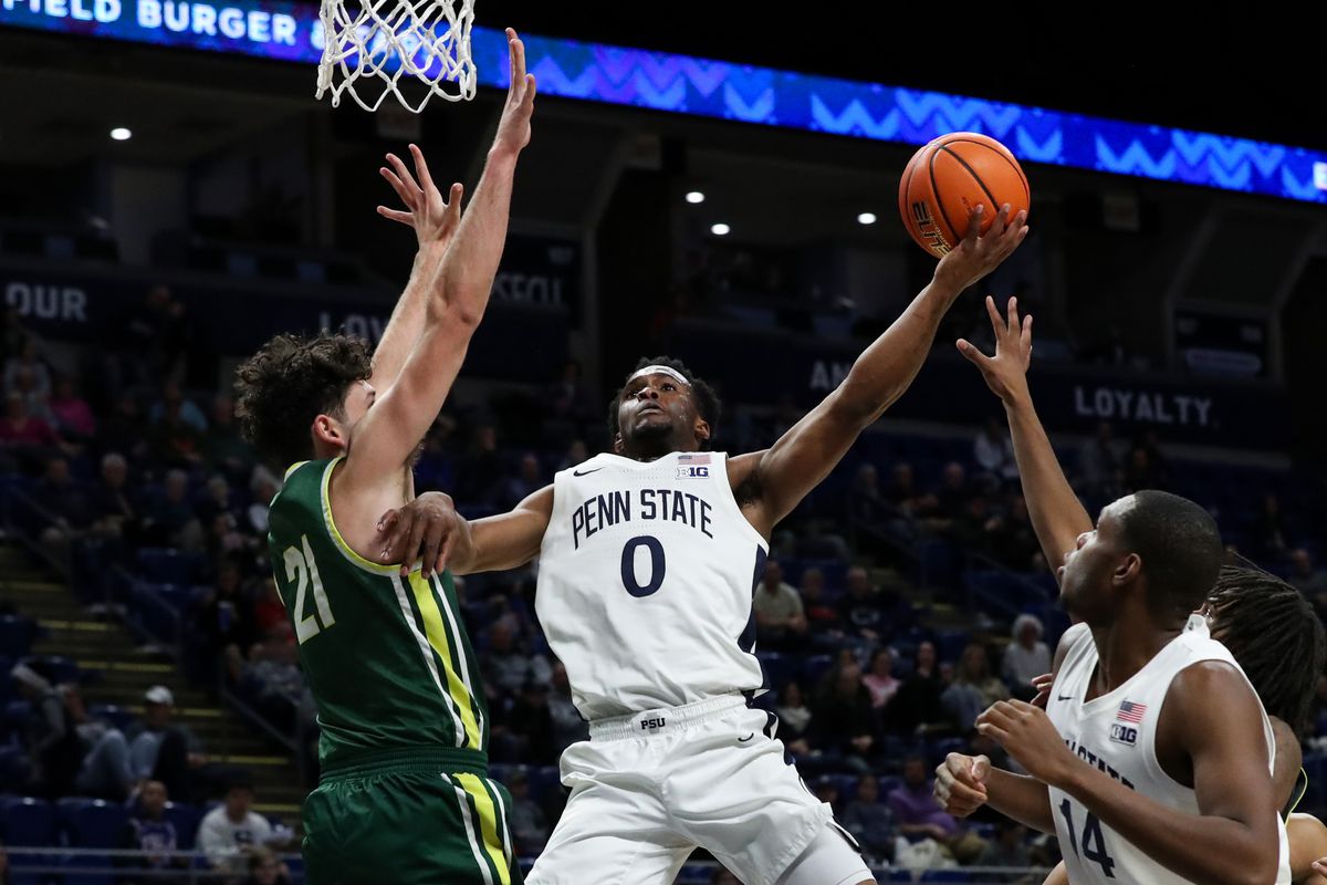 Penn State Nittany Lions guard Kanye Clary (0) drives the ball to the basket as Le Moyne Dolphins guard Trent Mosquera (21) defends during the first half at Bryce Jordan Center.