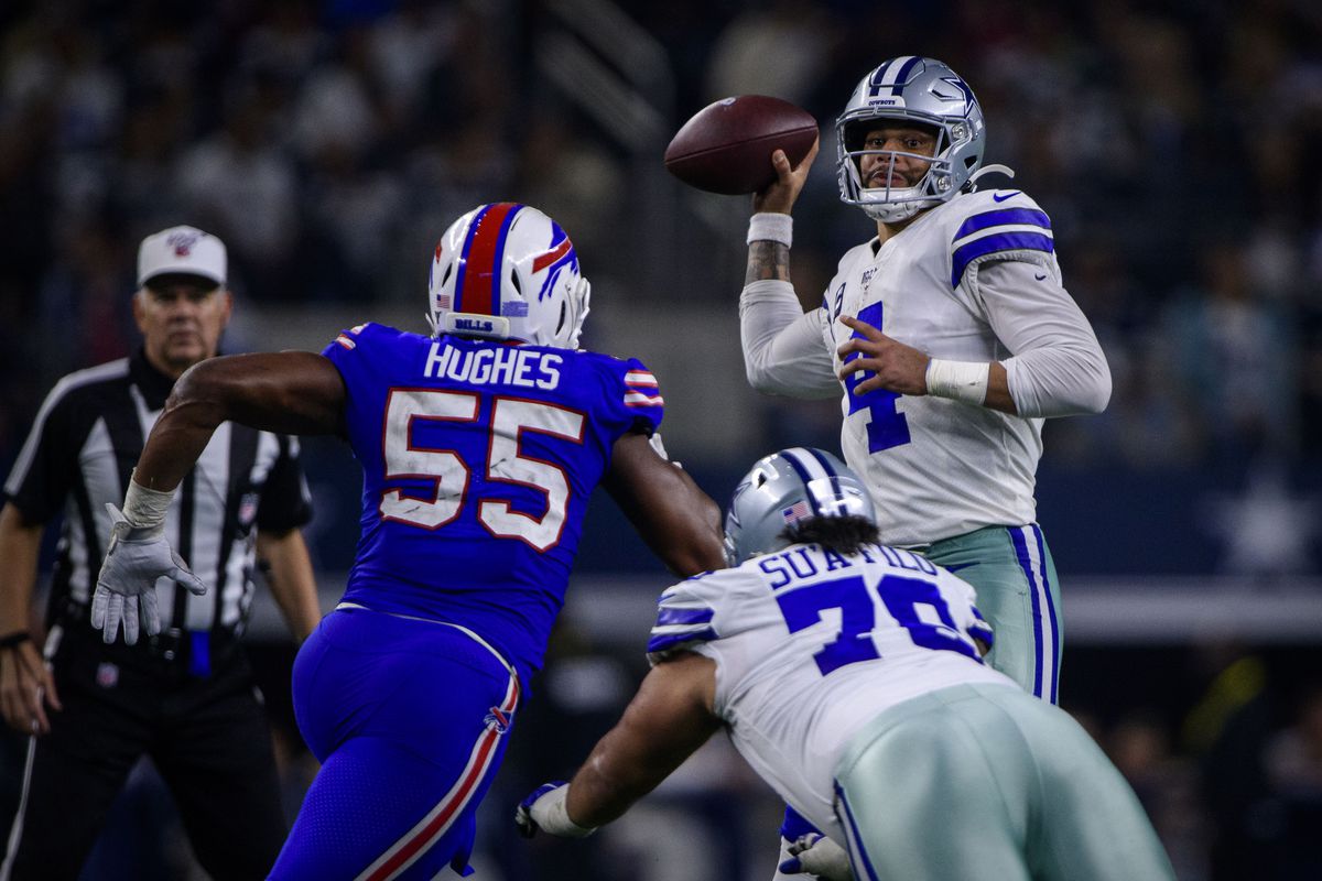 Buffalo Bills defensive end Jerry Hughes and Dallas Cowboys quarterback Dak Prescott (4) in action during the game between the Bills and Cowboys at AT&amp;T Stadium.