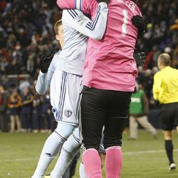 Sporting's Chance Myers jumps into the arms of 'keeper Jimmy Nielsen as Sporting KC defeats Real Salt Lake Saturday, Dec. 7, 2013 in MLS Cup action.