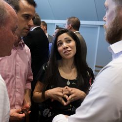 Enedina Stanger, center, speaks with Connor Boyack, president of the Libertas Institute, after a press conference at the Utah State Office Building in Salt Lake City on Thursday, Aug. 23, 2018, in which a broad coalition of Utah community leaders announced its opposition to Utah's medical marijuana ballot initiative. Stanger moved from Utah to Colorado so she could legally access her drugs for a joint condition called Ehlers-Danlos syndrome. Stanger is now opposed to the ballot initiative.