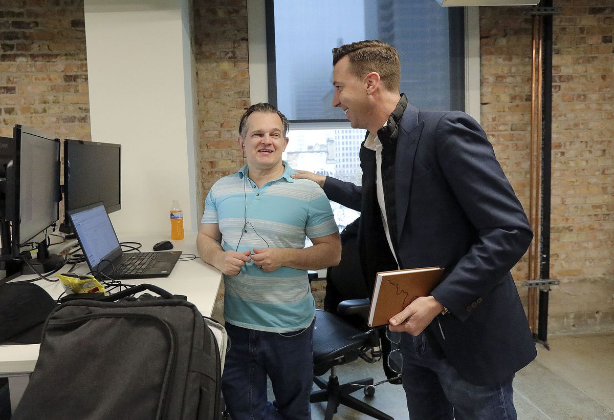 Ryan Westwood, Simplus CEO, right, talks with Shane Howard, Simplus global operations officer, at the company’s office in Salt Lake City on Thursday, Dec. 9, 2021.