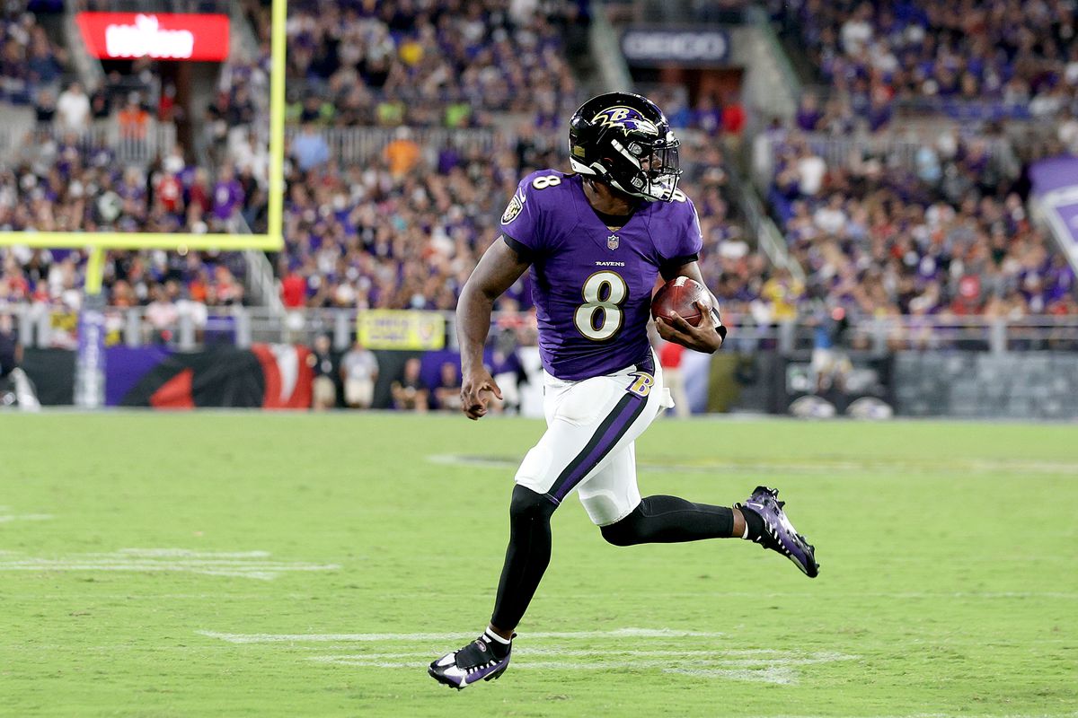 Lamar Jackson #8 of the Baltimore Ravens rushes for a touchdown against the Kansas City Chiefs during the fourth quarter at M&amp;T Bank Stadium on September 19, 2021 in Baltimore, Maryland.