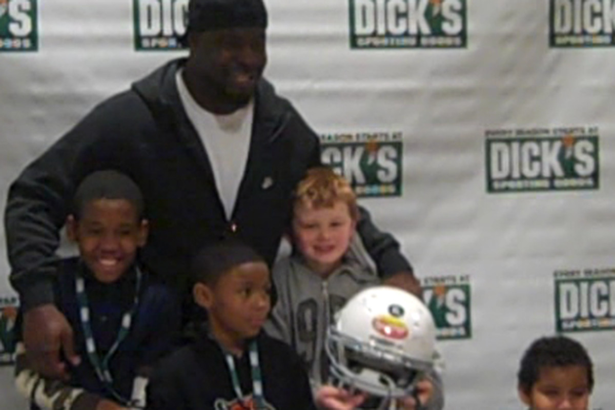 Frostee Rucker with his group of kids at an event at Dick's Sporting Goods near the Kenwood Towne Center in Cincinnati on Tuesday December 13, 2011.