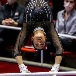 Utah’s Alexia Burch performs on the bars as Utah and UCLA compete in a gymnastics meet at the Huntsman Center in Salt Lake City on Friday, Feb. 19, 2021.