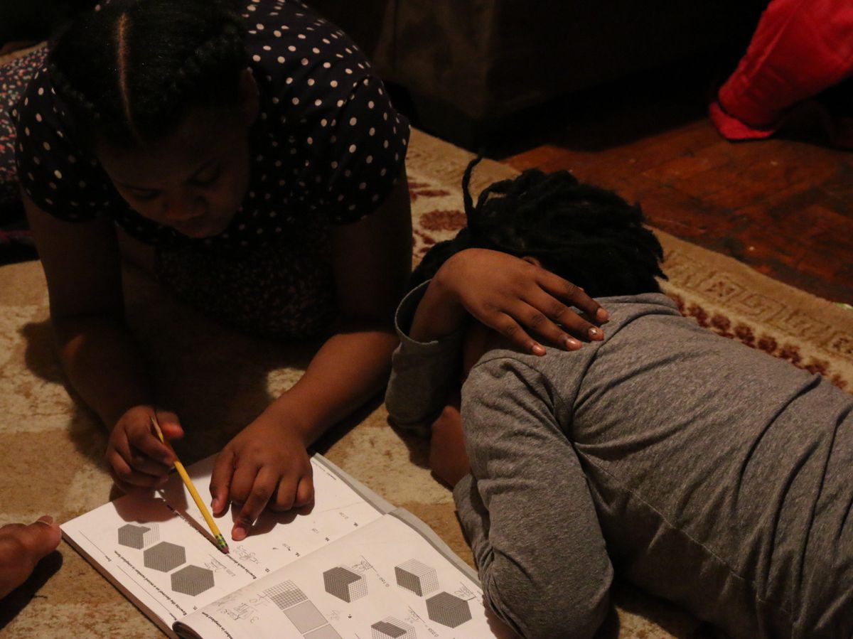 Bishop’s sister tries to help him complete his math homework as he loses focus.