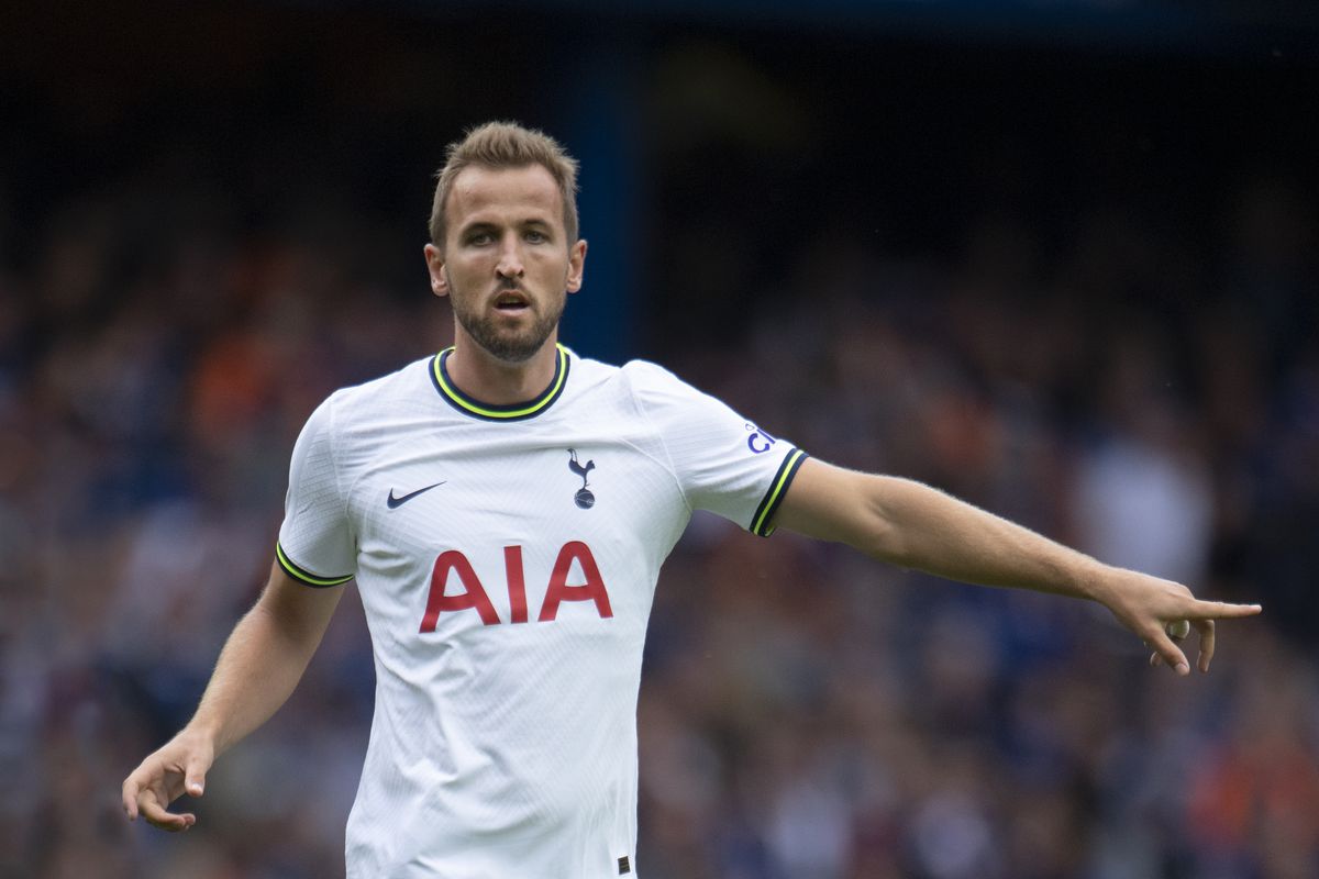 Harry Kane points to his left during friendly action against Rangers