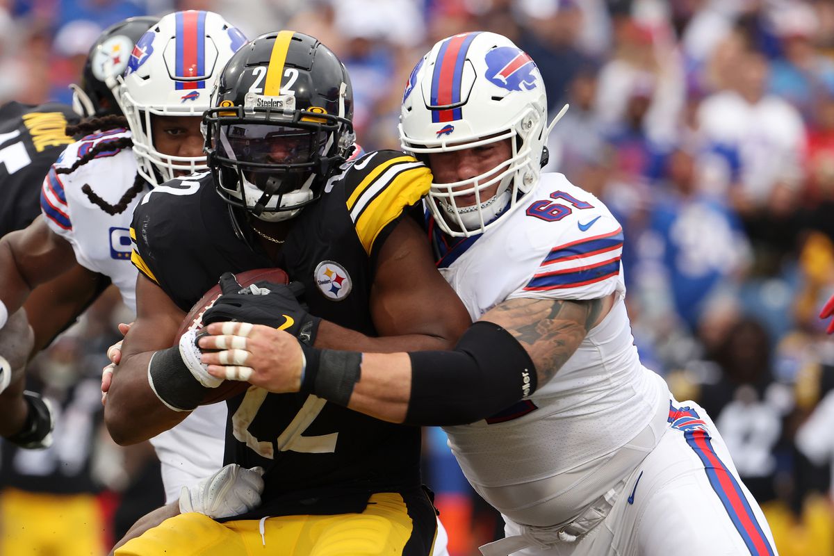 Najee Harris #22 of the Pittsburgh Steelers is hit by Justin Zimmer #61 of the Buffalo Bills during the first half at Highmark Stadium on September 12, 2021 in Orchard Park, New York.