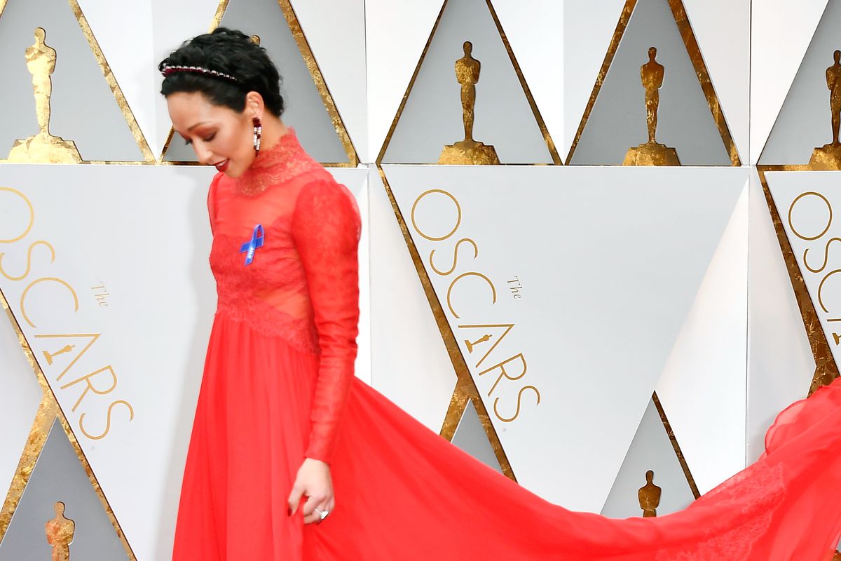 Ruth Negga on the Oscars red carpet with her ACLU blue ribbon