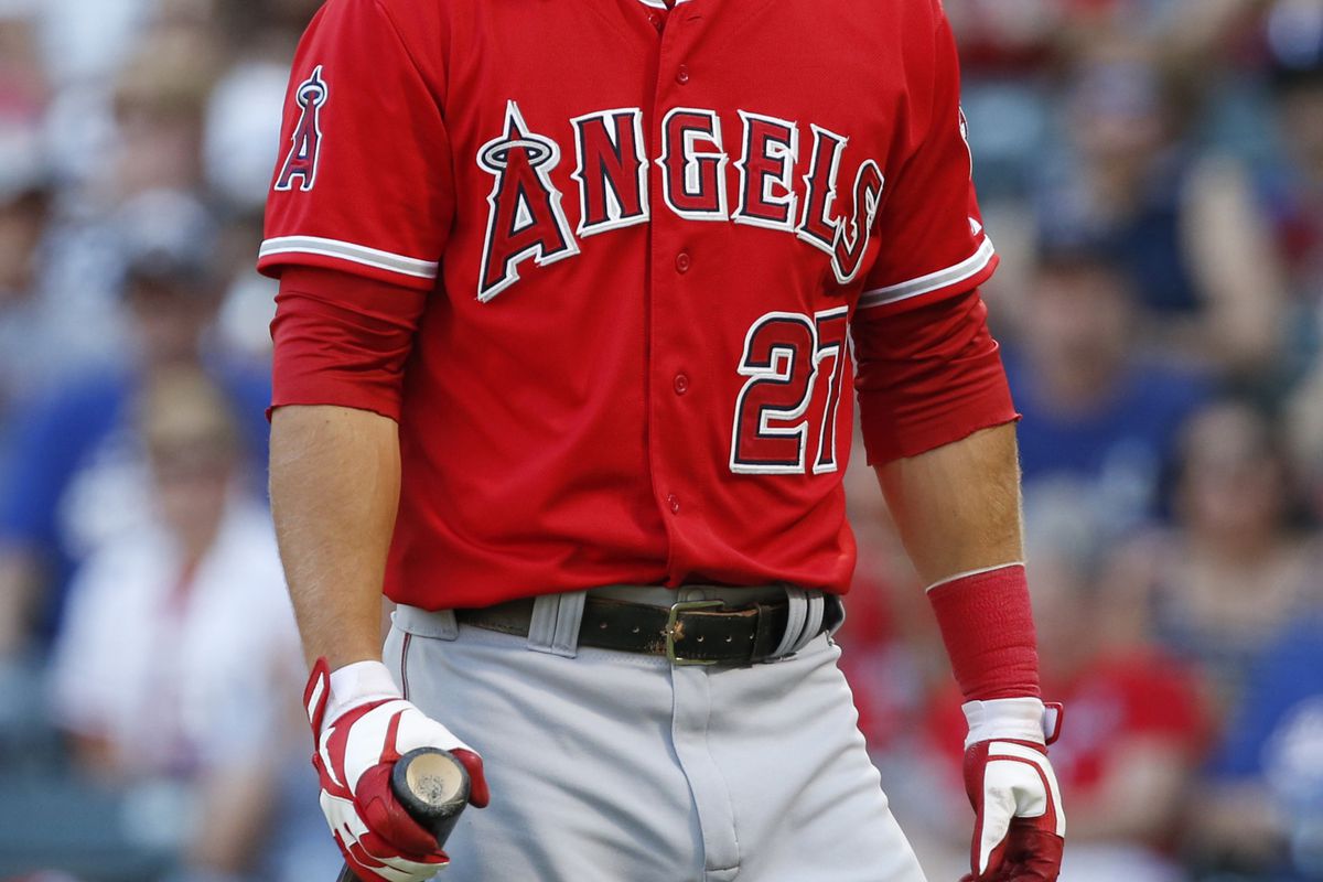 August 1, 2012; Arlington, TX, USA; Los Angeles Angels center fielder Mike Trout (27) reacts to striking out against the Texas Rangers in the first inning at Rangers Ballpark in Arlington. Mandatory Credit: Jim Cowsert-US PRESSWIRE