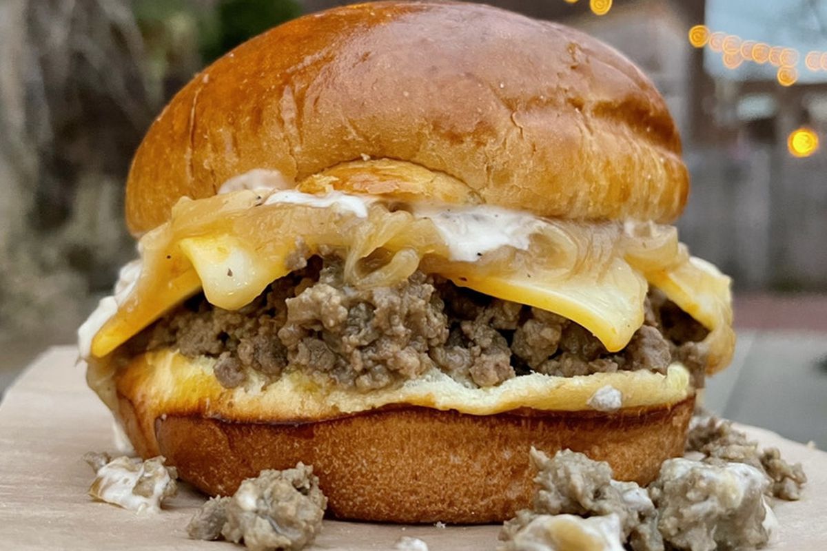 a loose meat sandwich with cheese