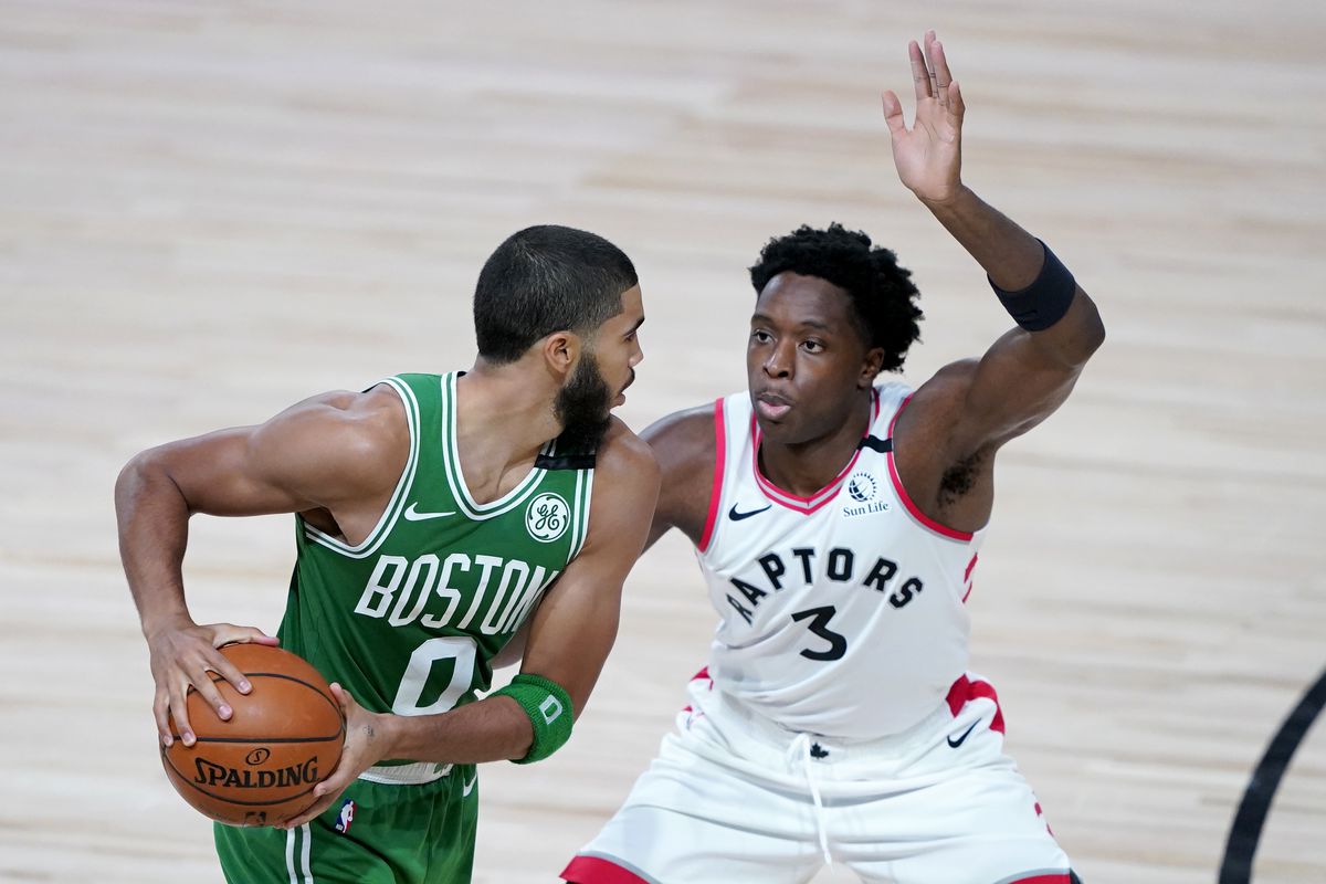 Boston Celtics’ Jayson Tatum works against Toronto Raptors’ OG Anunoby during the second half of an NBA basketball game at The Arena.