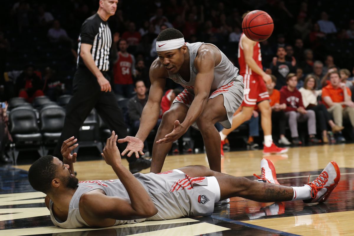 New Mexico Lobos guard JaQuan Lyle reacts with guard JJ Caldwell in the second half of the Roman Legends Classic against the Wisconsin Badgers at Barclays Center.