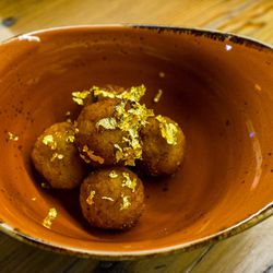 Potato and fontina croquettes with gold leaf