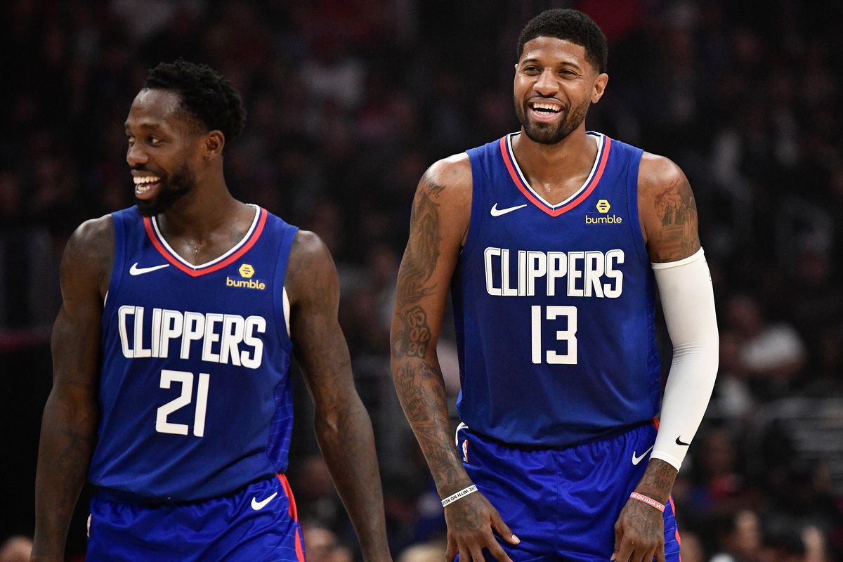 LA Clippers forward Paul George and LA Clippers guard Patrick Beverley share a laugh during the second quarter against the New Orleans Pelicans at Staples Center.