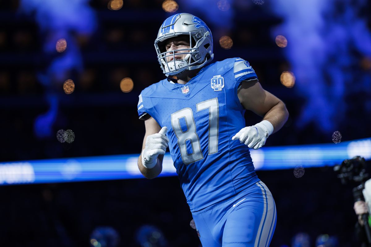 Sam LaPorta of the Detroit Lions runs onto the field during player introductions before an NFL football game against the Denver Broncos at Ford Field on December 16, 2023 in Detroit, Michigan.