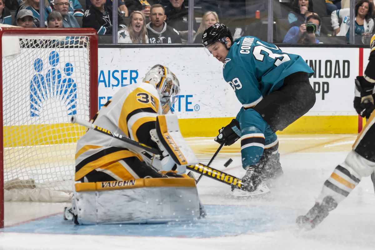 San Jose Sharks center Logan Couture (39) tries to grab a piece of the puck in front of Pittsburgh Penguins goaltender Tristan Jarry (35) during the game between the Pittsburg Penguins and the San Jose Sharks on Saturday, February 29, 2020 at the HP Pavilion (SAP Center) in San Jose, California.
