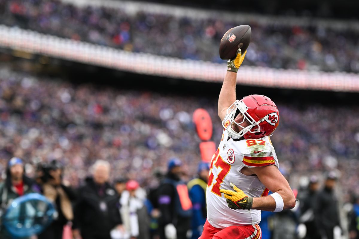 Travis Kelce of the Kansas City Chiefs goes to spike the football after scoring a touchdown during the first half of the AFC Championship game against the Baltimore Ravens at M&amp;T Bank Stadium on January 28, 2024 in Baltimore, Maryland.