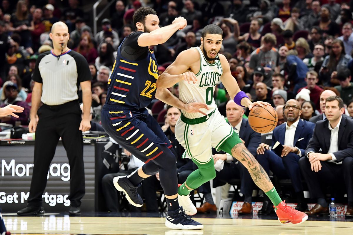 Boston Celtics forward Jayson Tatum drives to the basket against Cleveland Cavaliers forward Larry Nance Jr. during the second half at Rocket Mortgage FieldHouse.