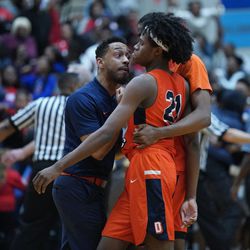 Young’s assistant coach consoles DJ Steward (21) after their loss to Curie, Friday 03-08-19. Worsom Robinson/For the Sun-Times.