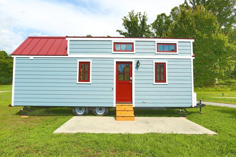 A blue and red tiny home. 