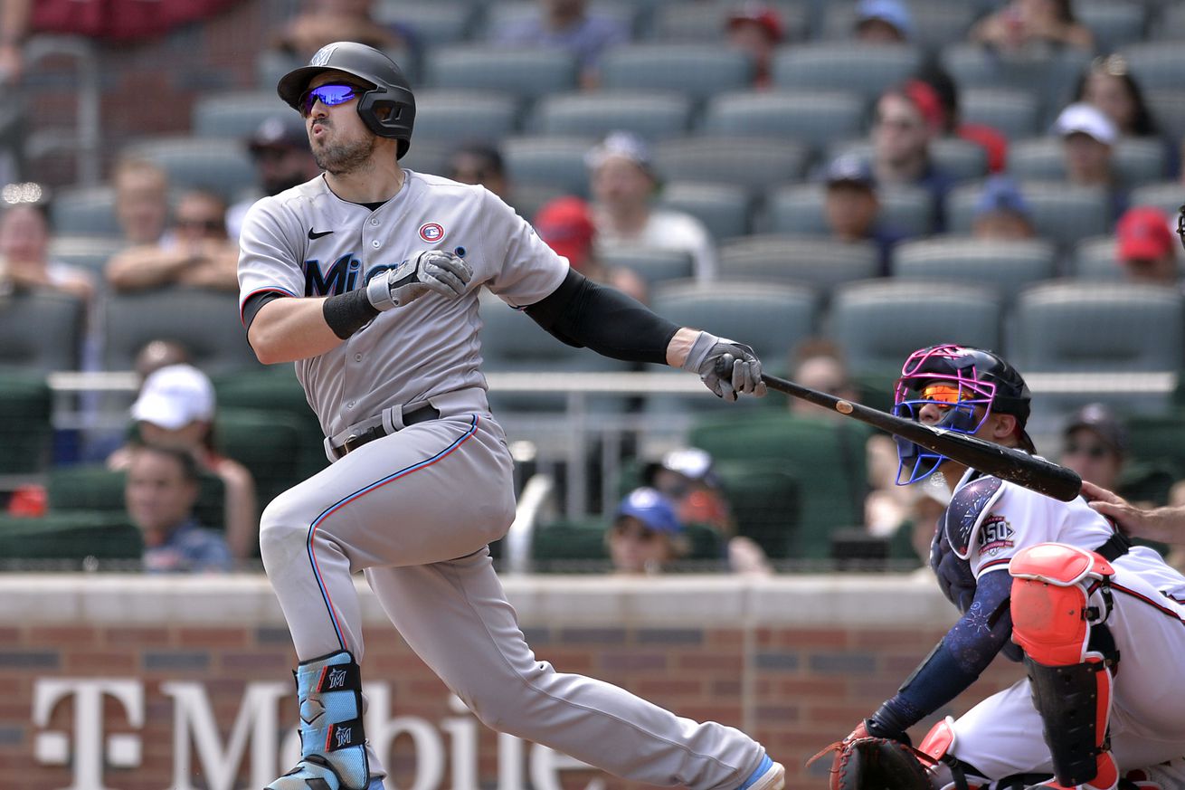 Adam Duvall #14 of the Miami Marlins bats during a game against the Atlanta Braves at Truist Park