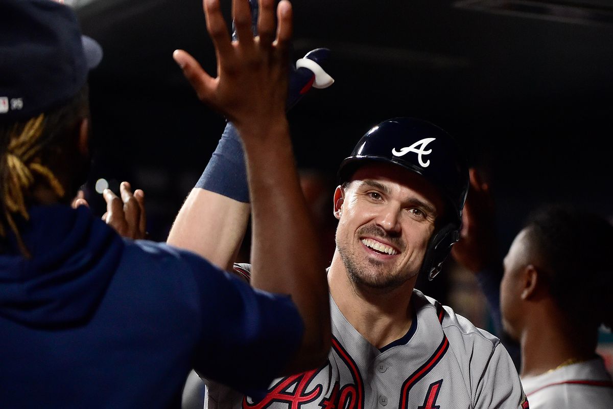 Atlanta Braves left fielder Adam Duvall (14) celebrates with teammates after hitting a two run home run during the sixth inning against the St. Louis Cardinals at Busch Stadium.