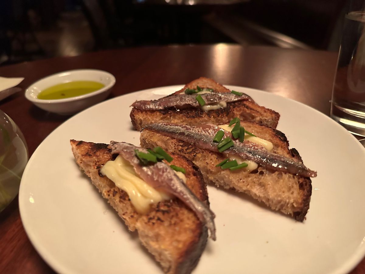 Anchovies and butter on bread.