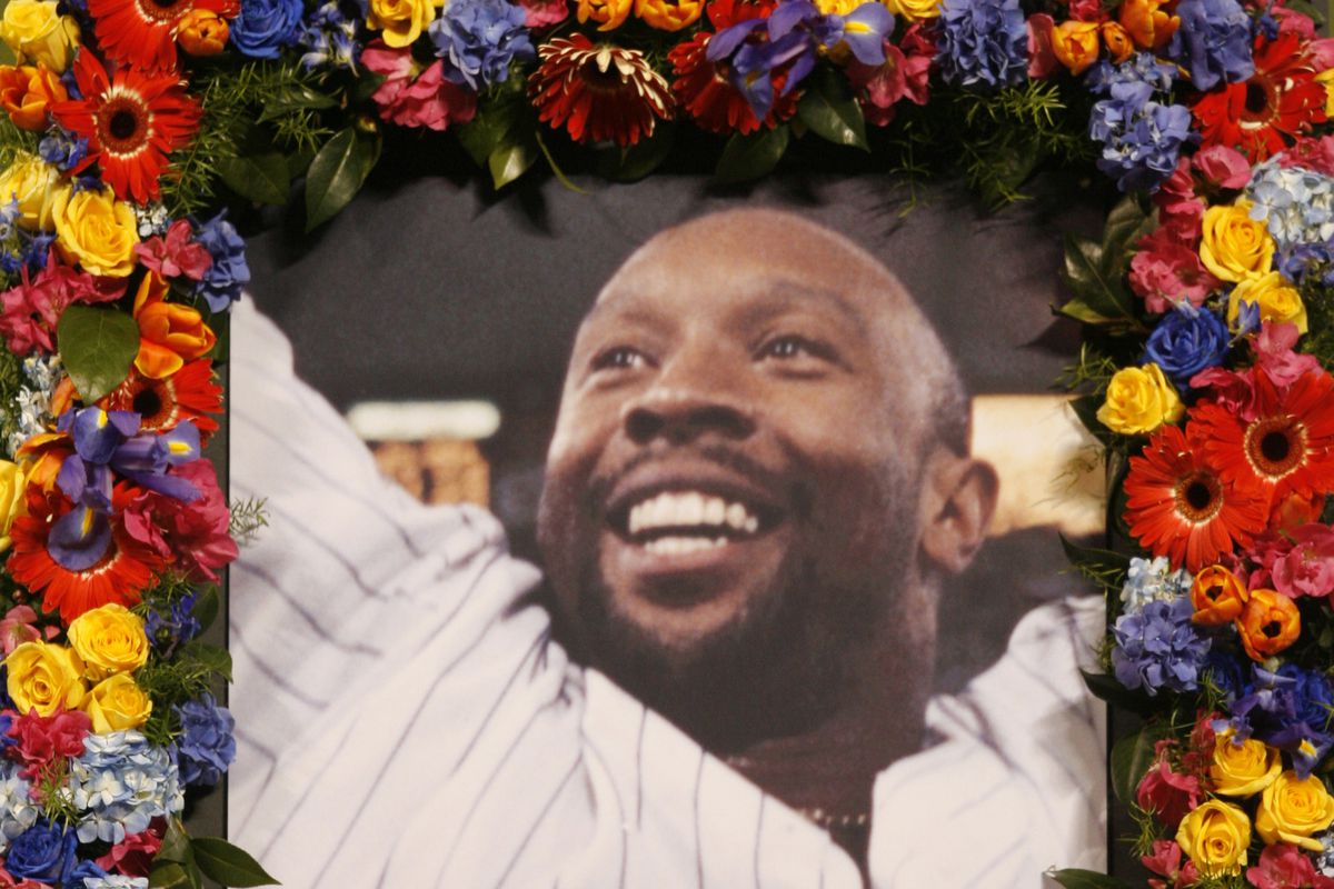 JERRY HOLT ¬• jholt@startribune.com - Metrodome-Minneapolis, MN - 3/12/06 - Puckett Memorial - A photo of Kirby Puckett is framed by fresh flowers on the field.