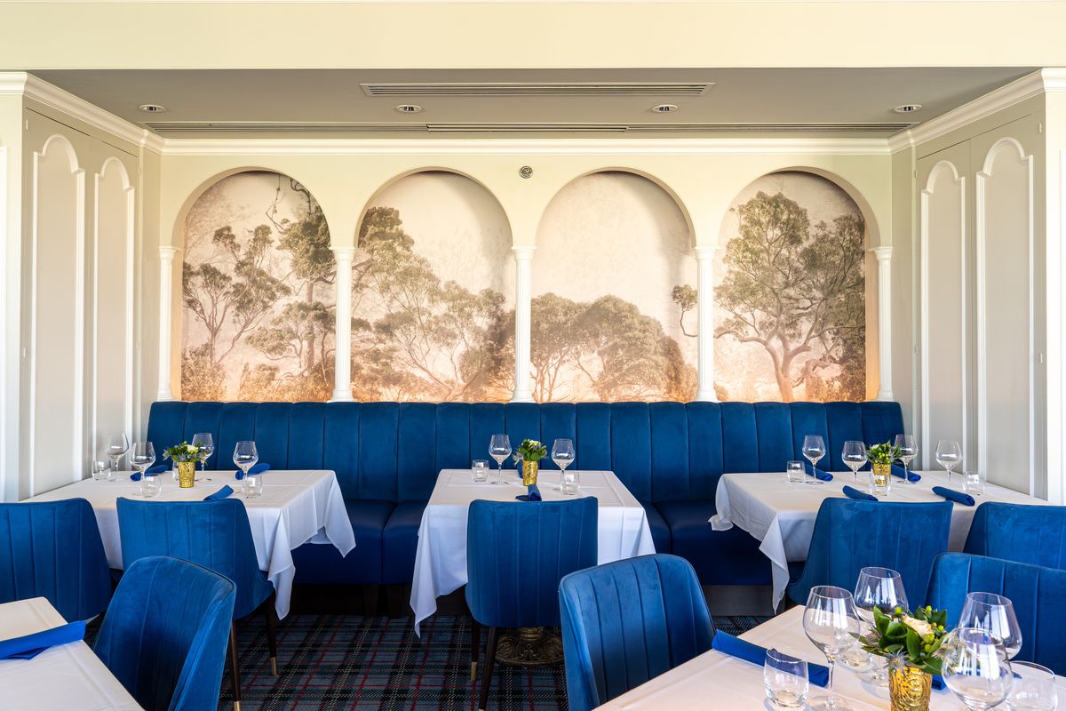 A Balboa Park-inspired mural in a dining room.