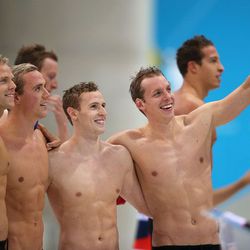 British swimmers (L-R) Ross Davenport, Robbie Renwick, Rob Bale and David Carry celebrate after competing in the Men’s 4 x 200m Freestyle heat. (Photo by Clive Rose/Getty Images)