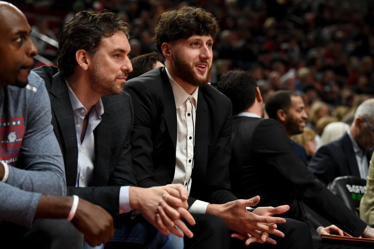 Injured Portland Trail Blazers Portland Trail Blazers forward Pau Gasol and Portland Trail Blazers center Jusuf Nurkic chat on the bench during the first quarter of the game against the Brooklyn Nets at Moda Center.&nbsp;