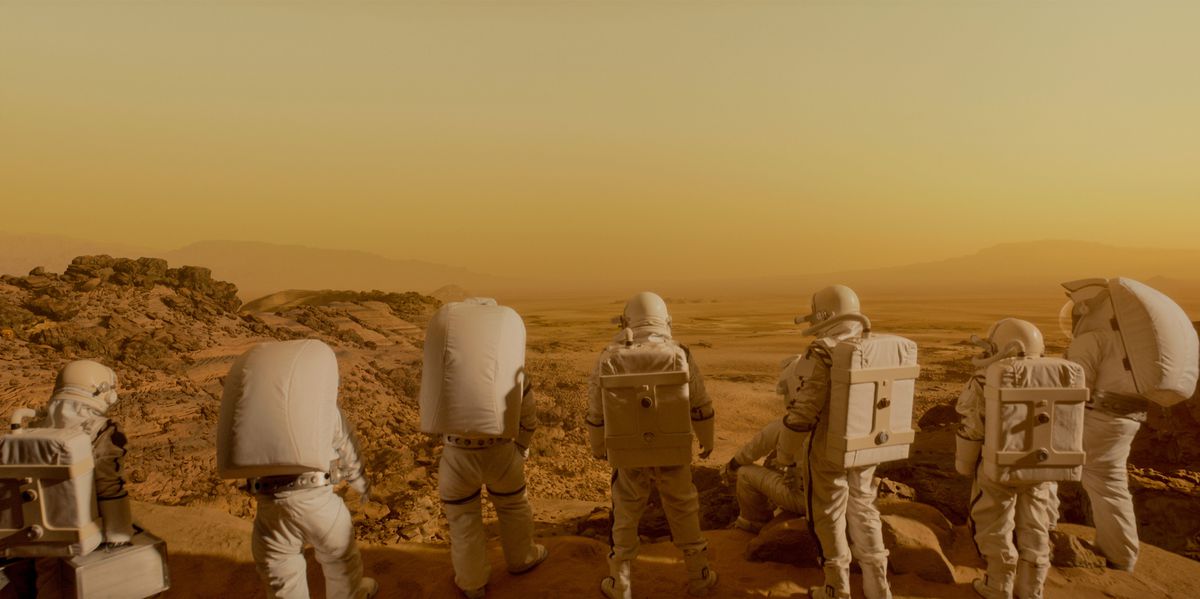 A group of astronauts looking out at Mars