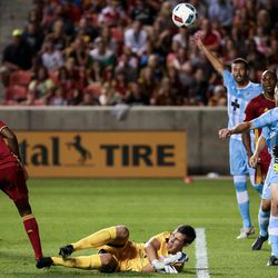 Wilmington midfielder Logan Miller (14), right, blocks the ball as Wilmington goalkeeper John Smits (1) tumbles during a U.S. Open Cup game at Rio Tinto Stadium in Sandy on Tuesday, June 14, 2016.