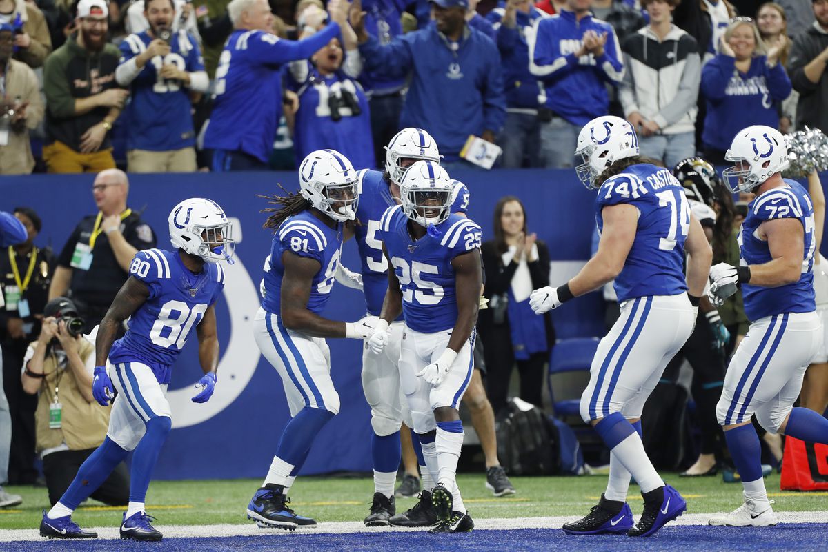 Indianapolis Colts running back Marlon Mack celebrates with teammates after scoring a touchdown against the Jacksonville Jaguars during the first quarter at Lucas Oil Stadium.